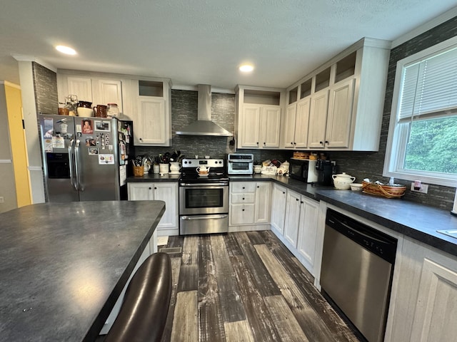 115 Wolf Creek Crossing Rd, Nancy, KY 42544 - kitchen with wall chimney range hood, appliances with stainless steel finishes, dark countertops, and dark wood-style flooring