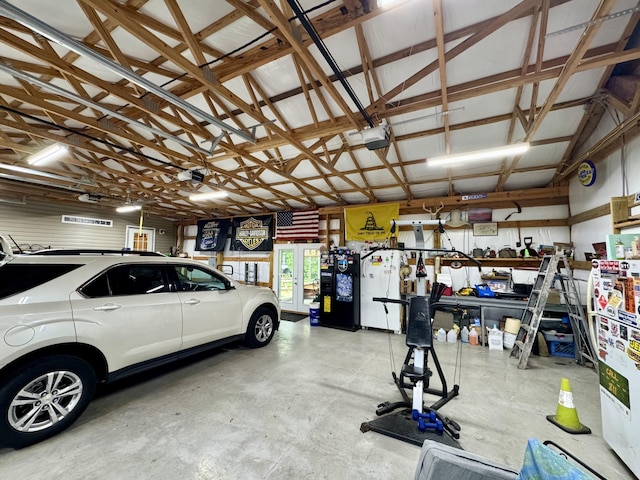 115 Wolf Creek Crossing Rd, Nancy, KY 42544 - garage featuring a garage door opener and freestanding refrigerator