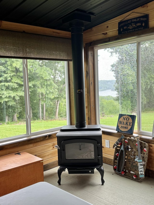 115 Wolf Creek Crossing Rd, Nancy, KY 42544 - detailed view of a wood stove, carpet, and wooden walls