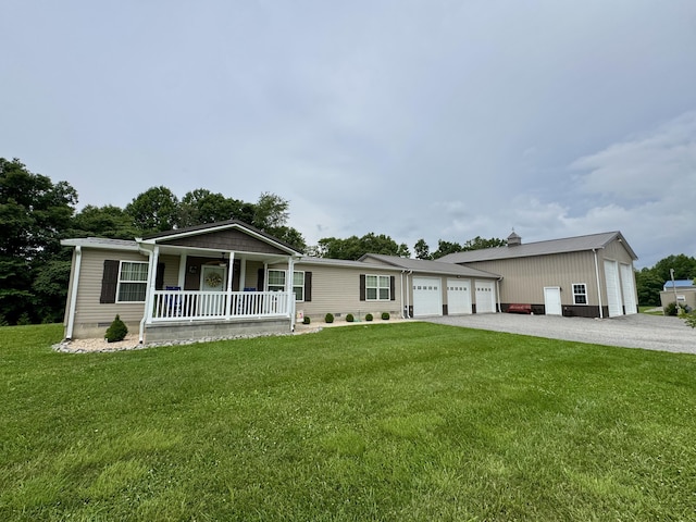 115 Wolf Creek Crossing Rd, Nancy, KY 42544 - view of front facade featuring a porch, a front yard, and an attached garage