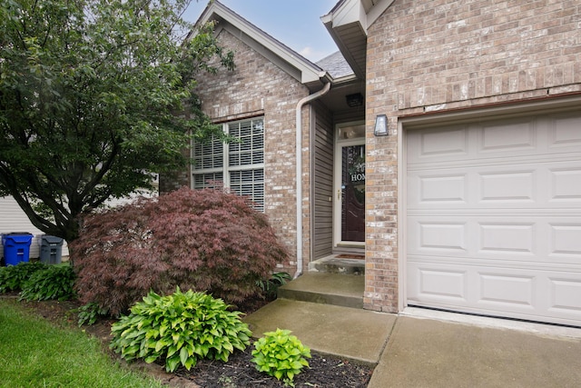 3008 Roundway Down Ln, Lexington, KY 40509 - doorway to property with an attached garage and brick siding