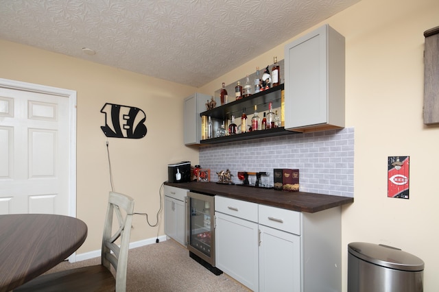3008 Roundway Down Ln, Lexington, KY 40509 - indoor dry bar with wine cooler, backsplash, and carpet flooring
