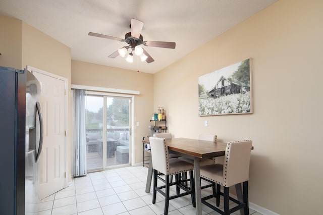 3008 Roundway Down Ln, Lexington, KY 40509 - dining area featuring a ceiling fan, light tile patterned flooring, and baseboards