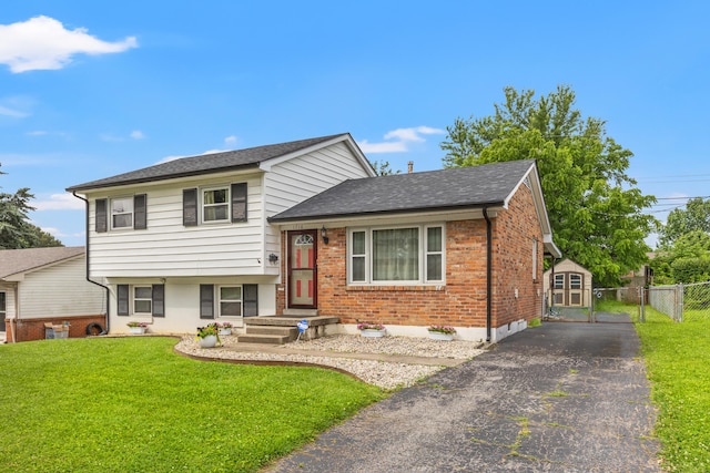 1716 Biloxi Ct, Lexington, KY 40505 - split level home featuring driveway, brick siding, roof with shingles, and a gate