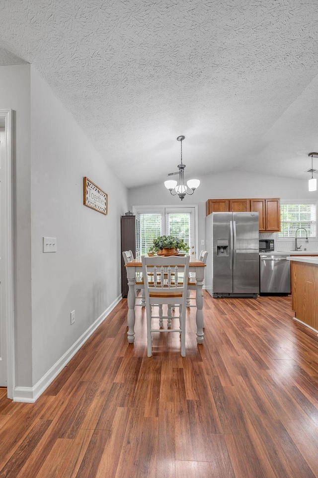 1416 Equine Way, Frankfort, KY 40601 - dining room with dark wood-style floors, a chandelier, vaulted ceiling, a textured ceiling, and baseboards