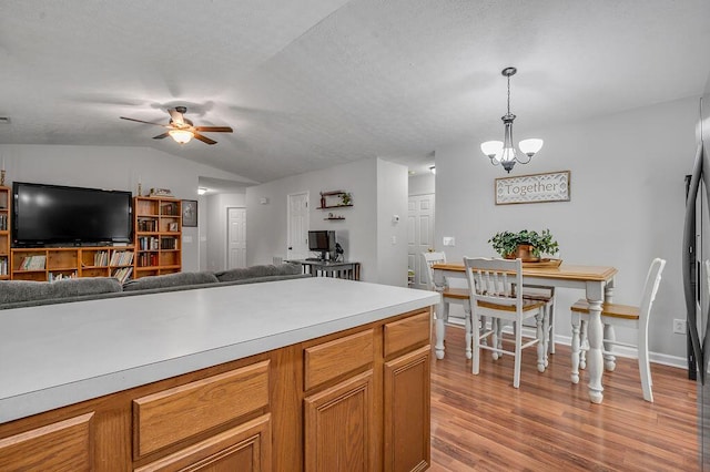 1416 Equine Way, Frankfort, KY 40601 - kitchen featuring ceiling fan, vaulted ceiling, hanging light fixtures, light wood finished floors, and open floor plan