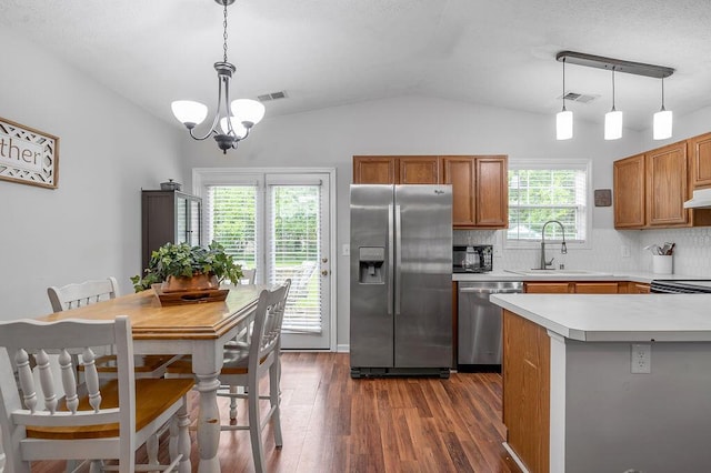 1416 Equine Way, Frankfort, KY 40601 - kitchen with appliances with stainless steel finishes, lofted ceiling, a sink, brown cabinetry, and dark wood-style floors