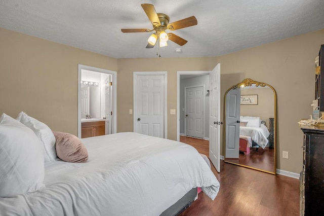 1416 Equine Way, Frankfort, KY 40601 - bedroom with dark wood-style floors, a ceiling fan, baseboards, and connected bathroom