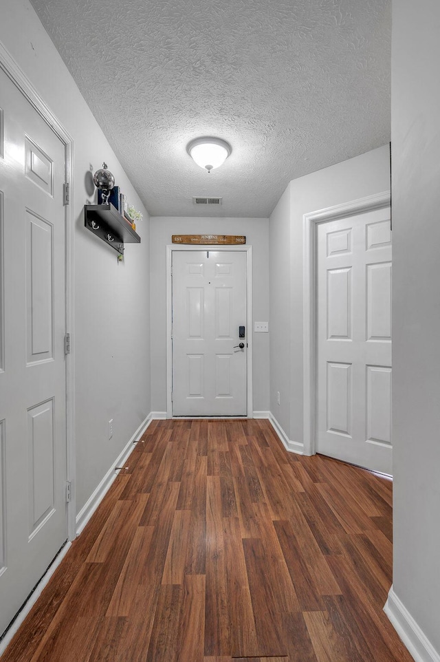 1416 Equine Way, Frankfort, KY 40601 - entryway featuring dark wood-type flooring, baseboards, and a textured ceiling