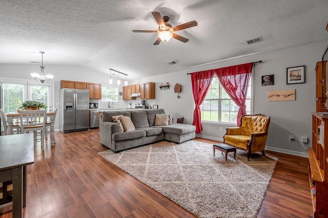 1416 Equine Way, Frankfort, KY 40601 - living room featuring ceiling fan, a chandelier, a textured ceiling, healthy amount of natural light, and dark wood-type flooring
