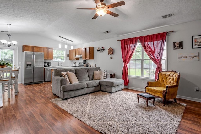 1416 Equine Way, Frankfort, KY 40601 - living room with a chandelier, a textured ceiling, dark wood-type flooring, healthy amount of natural light, and vaulted ceiling