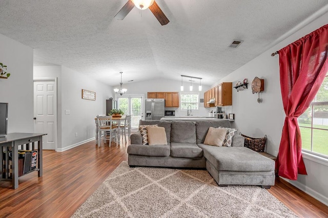 1416 Equine Way, Frankfort, KY 40601 - living room with wood finished floors, ceiling fan, a chandelier, a textured ceiling, and lofted ceiling