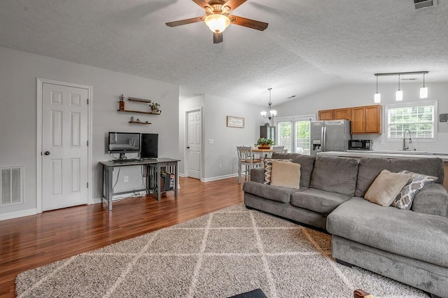 1416 Equine Way, Frankfort, KY 40601 - living area with wood finished floors, a ceiling fan, a textured ceiling, lofted ceiling, and a chandelier
