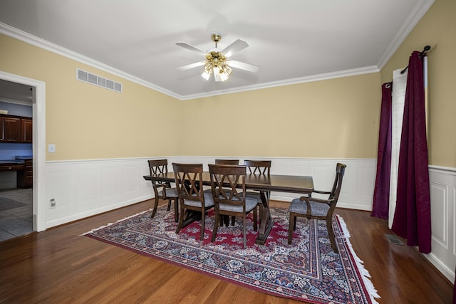 1369 Saddle Club Way, Lexington, KY 40504 - dining space with crown molding, wood finished floors, ceiling fan, and wainscoting