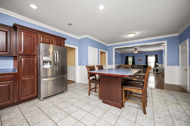 1369 Saddle Club Way, Lexington, KY 40504 - dining room with wainscoting, ornamental molding, a ceiling fan, light tile patterned floors, and a decorative wall