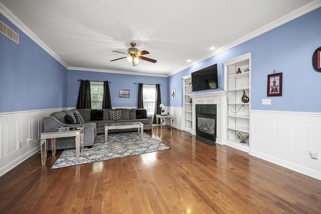 1369 Saddle Club Way, Lexington, KY 40504 - living area featuring a ceiling fan, hardwood / wood-style floors, a fireplace with flush hearth, built in shelves, and wainscoting