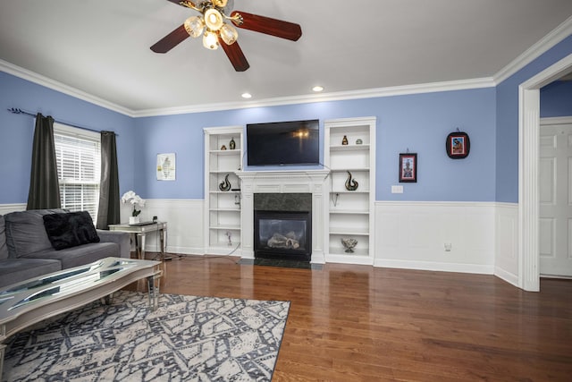 1369 Saddle Club Way, Lexington, KY 40504 - living area featuring a ceiling fan, crown molding, a wainscoted wall, wood finished floors, and a high end fireplace