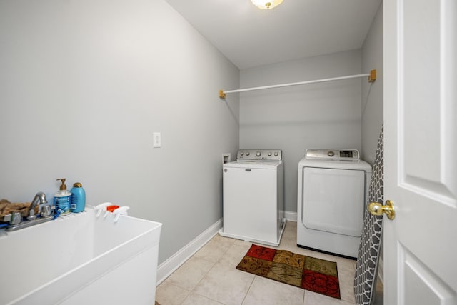 1369 Saddle Club Way, Lexington, KY 40504 - laundry room with washing machine and clothes dryer, light tile patterned floors, and baseboards