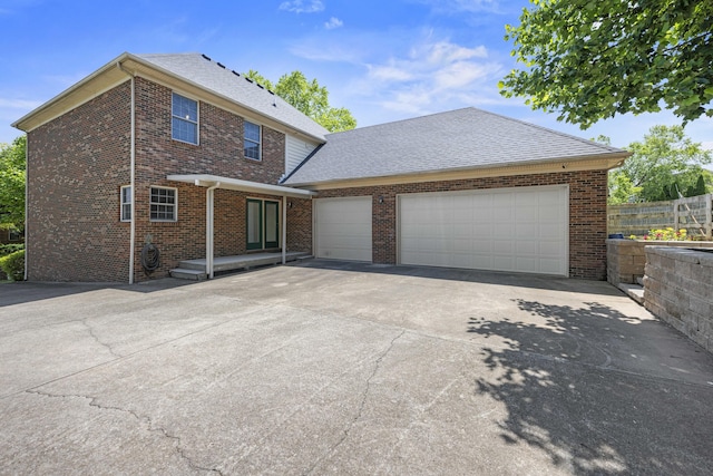 1369 Saddle Club Way, Lexington, KY 40504 - traditional-style home with driveway, brick siding, an attached garage, and roof with shingles