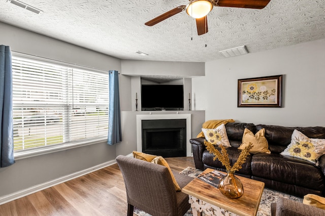 416 Scottsdale Cir, Lexington, KY 40511 - living area with ceiling fan, a fireplace, and wood finished floors