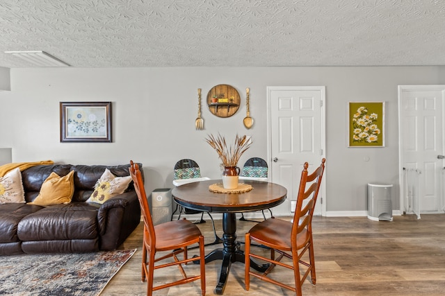 416 Scottsdale Cir, Lexington, KY 40511 - dining space with wood finished floors and a textured ceiling
