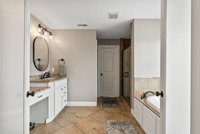1022 Forest Hill Dr, Lawrenceburg, KY 40342 - bathroom featuring vanity, a garden tub, a stall shower, and stone tile flooring