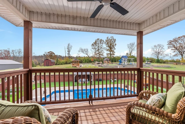 1022 Forest Hill Dr, Lawrenceburg, KY 40342 - wooden terrace with a ceiling fan, a playground, and a storage unit