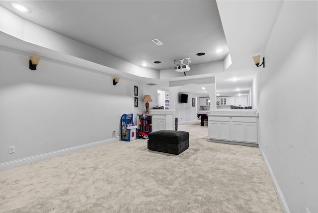 1022 Forest Hill Dr, Lawrenceburg, KY 40342 - living room featuring light carpet, recessed lighting, a tray ceiling, and arched walkways