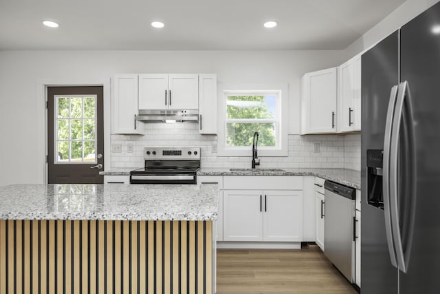 460 Spring St, Mt Sterling, KY 40353 - kitchen featuring stainless steel appliances, under cabinet range hood, healthy amount of natural light, decorative backsplash, and recessed lighting