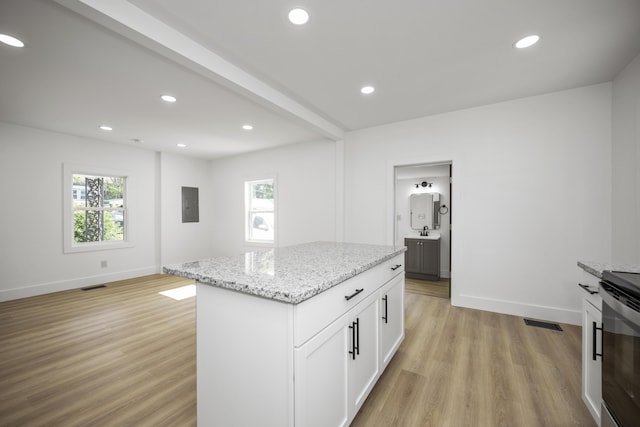 460 Spring St, Mt Sterling, KY 40353 - kitchen with light wood-type flooring, light stone countertops, electric panel, recessed lighting, and white cabinetry