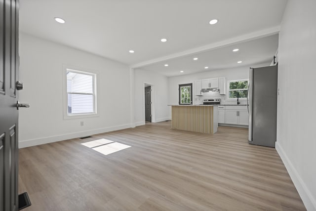 460 Spring St, Mt Sterling, KY 40353 - unfurnished living room with recessed lighting and light wood-style floors