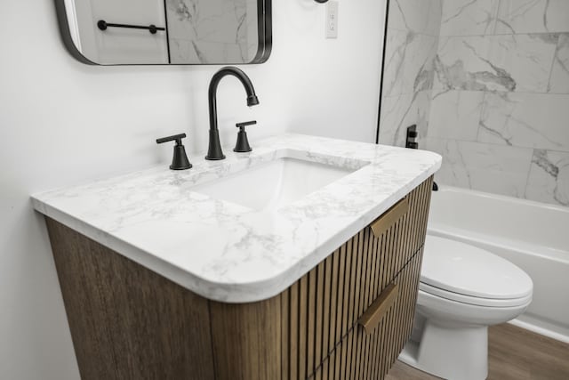 460 Spring St, Mt Sterling, KY 40353 - full bath featuring vanity, wood finished floors, and bathing tub / shower combination