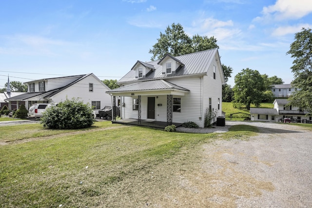 460 Spring St, Mt Sterling, KY 40353 - view of front of home with covered porch, a front lawn, and a metal roof