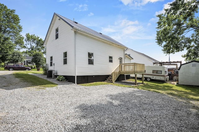 460 Spring St, Mt Sterling, KY 40353 - back of property with a wooden deck, a metal roof, and stairs
