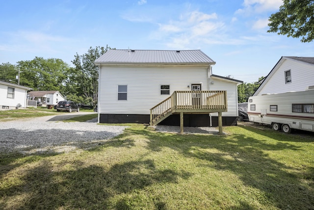 460 Spring St, Mt Sterling, KY 40353 - back of house with a wooden deck, a lawn, and a metal roof