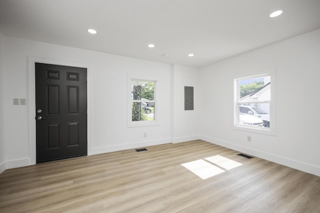 460 Spring St, Mt Sterling, KY 40353 - unfurnished room with electric panel, plenty of natural light, recessed lighting, and light wood-type flooring