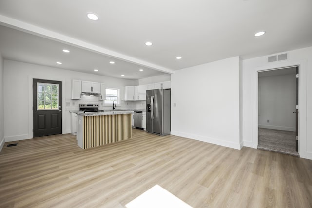 460 Spring St, Mt Sterling, KY 40353 - kitchen featuring appliances with stainless steel finishes, light countertops, a center island, light wood finished floors, and recessed lighting