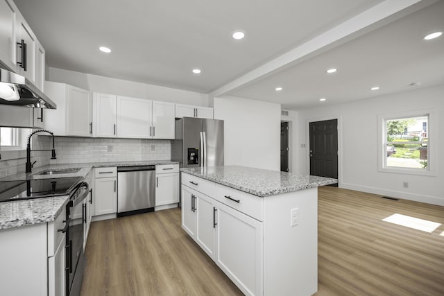 460 Spring St, Mt Sterling, KY 40353 - kitchen featuring appliances with stainless steel finishes, light wood finished floors, backsplash, light stone countertops, and recessed lighting