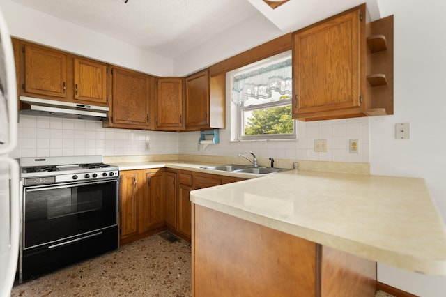 2299 Mcbrayer Rd, Clearfield, KY 40313 - kitchen featuring range with gas stovetop, under cabinet range hood, brown cabinets, and light countertops