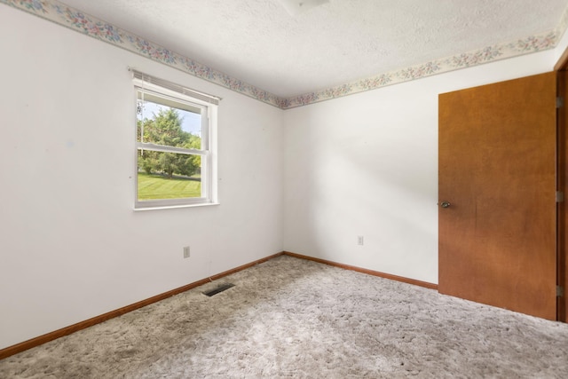2299 Mcbrayer Rd, Clearfield, KY 40313 - carpeted empty room featuring a textured ceiling and baseboards