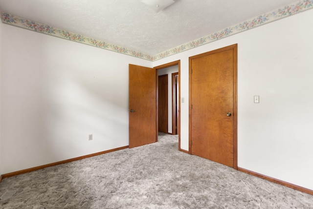 2299 Mcbrayer Rd, Clearfield, KY 40313 - empty room featuring carpet flooring and a textured ceiling