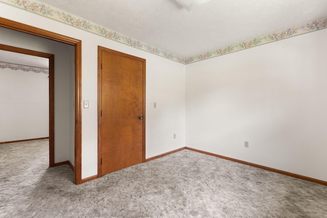 2299 Mcbrayer Rd, Clearfield, KY 40313 - unfurnished room with carpet and a textured ceiling
