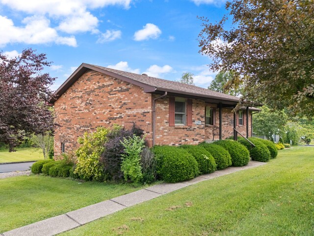 2299 Mcbrayer Rd, Clearfield, KY 40313 - view of side of property featuring brick siding and a lawn