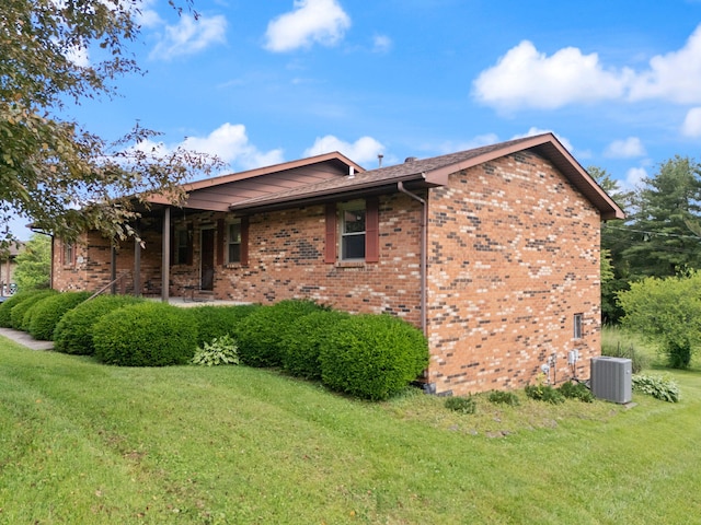2299 Mcbrayer Rd, Clearfield, KY 40313 - view of side of property featuring a lawn and brick siding