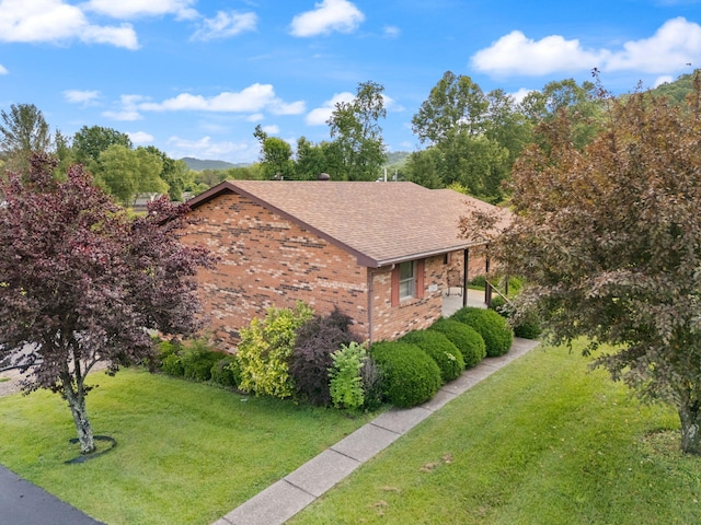 2299 Mcbrayer Rd, Clearfield, KY 40313 - view of side of home with brick siding, a yard, and a shingled roof