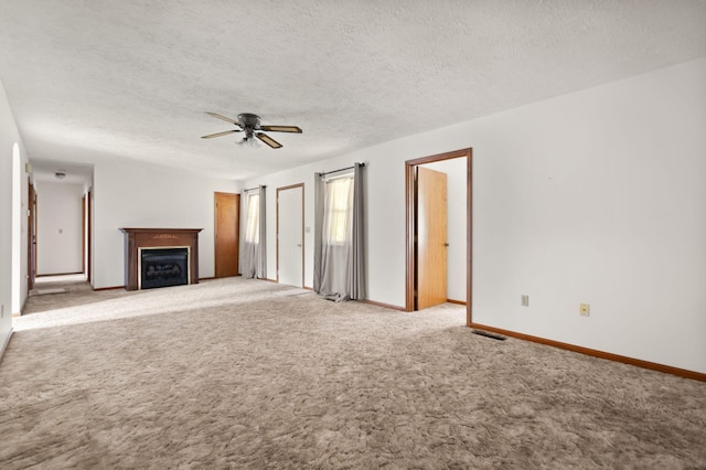 2299 Mcbrayer Rd, Clearfield, KY 40313 - unfurnished living room featuring ceiling fan, a fireplace, carpet floors, and a textured ceiling