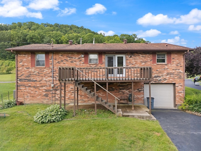 2299 Mcbrayer Rd, Clearfield, KY 40313 - back of property with a garage, a lawn, and driveway
