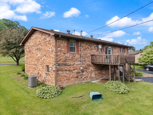 2299 Mcbrayer Rd, Clearfield, KY 40313 - rear view of house featuring a wooden deck, stairway, a yard, and brick siding