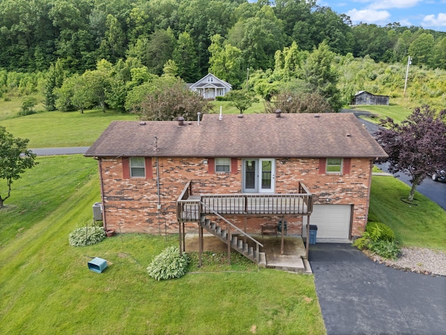 2299 Mcbrayer Rd, Clearfield, KY 40313 - view of front of home with brick siding, driveway, a front yard, and a deck