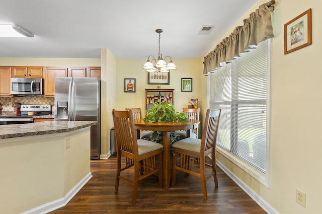 102 Dickinson Ct, Georgetown, KY 40324 - dining space featuring dark wood-style flooring, plenty of natural light, and a chandelier
